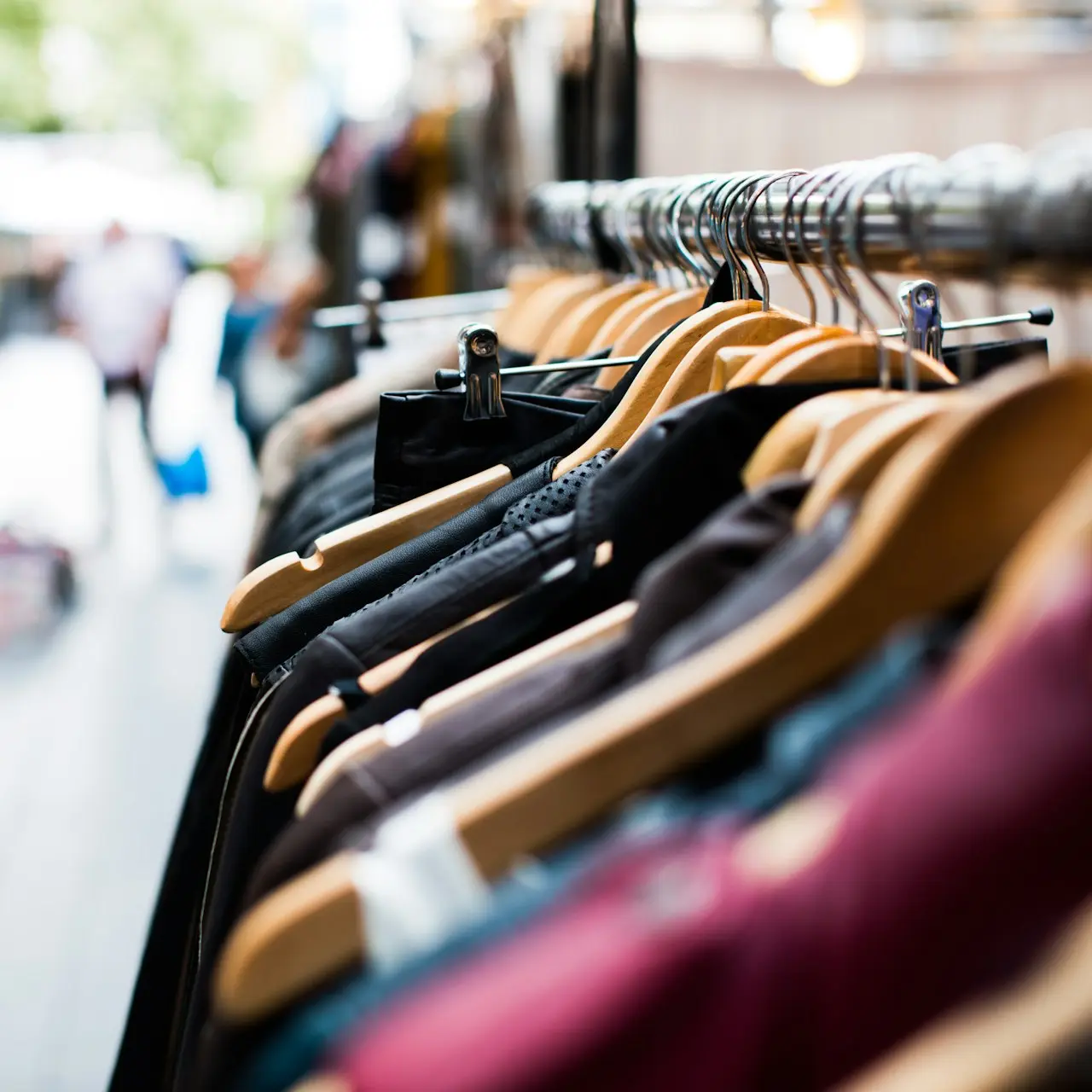 selective focus photography of hanged clothes